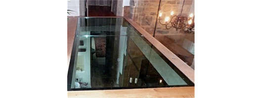 Laminated glass floor with Oak trims and Structural Glass balustrade