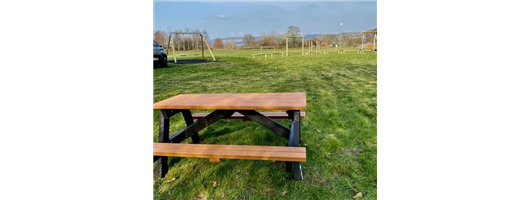 Playground with swings and trim trail plus recycled furniture