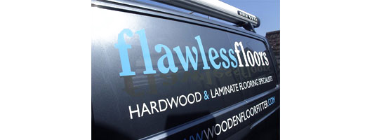 Basic blue and white vinyl text on signwritten vehicle 