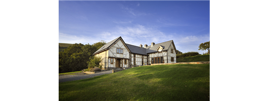 Renderplas beadscontribute to weather-tight external envelope of oak framed building