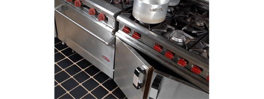 Resilient black pieces on tiles, industrial kitchen B